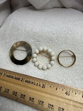 3 different Brooches. Gold-Tone and White Beaded Circle Brooch